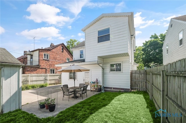 3743 Woodmont Rd, Toledo, OH 43613 - rear view of property featuring a fenced backyard and a patio area