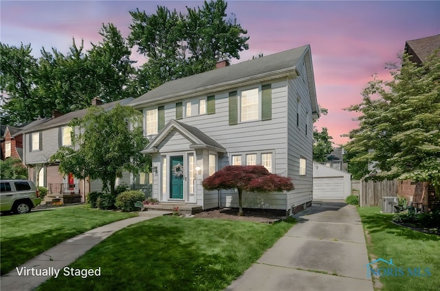 3743 Woodmont Rd, Toledo, OH 43613 - view of front of house with a garage and a chimney