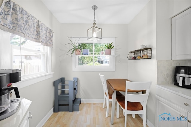 3743 Woodmont Rd, Toledo, OH 43613 - dining area with light wood-style floors and plenty of natural light