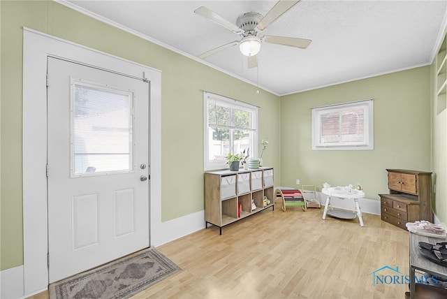 3743 Woodmont Rd, Toledo, OH 43613 - entryway featuring ornamental molding, light wood-style floors, and a ceiling fan