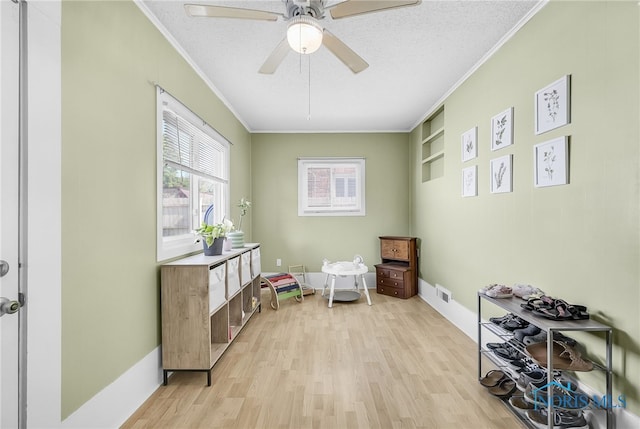 3743 Woodmont Rd, Toledo, OH 43613 - interior space featuring ornamental molding, light wood-style flooring, and ceiling fan