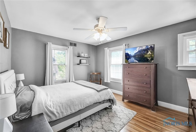 3743 Woodmont Rd, Toledo, OH 43613 - bedroom with light wood-type flooring and ceiling fan