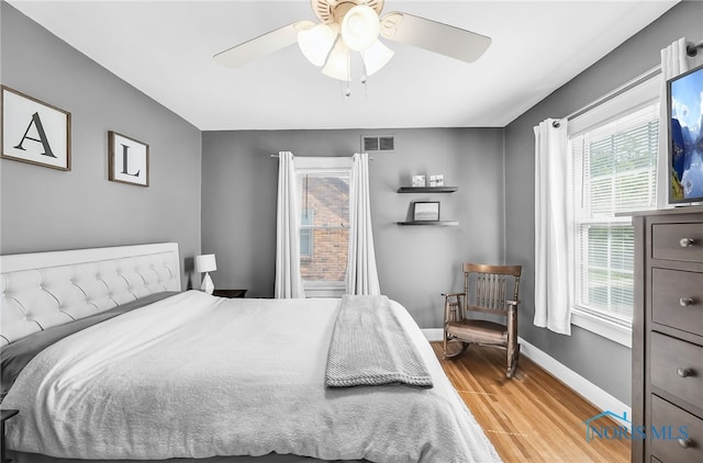 3743 Woodmont Rd, Toledo, OH 43613 - bedroom with light wood-style flooring and a ceiling fan