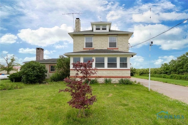 12044 W Duff Washa Rd, Oak Harbor, OH 43449 - american foursquare style home featuring driveway, a chimney, a front yard, and stone siding