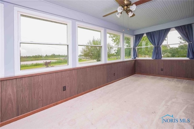 12044 W Duff Washa Rd, Oak Harbor, OH 43449 - unfurnished sunroom with healthy amount of natural light, carpet, and wooden walls