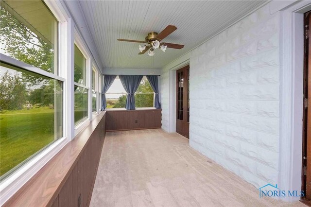 12044 W Duff Washa Rd, Oak Harbor, OH 43449 - unfurnished sunroom featuring ceiling fan and carpet