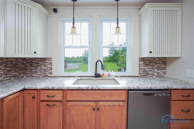 12044 W Duff Washa Rd, Oak Harbor, OH 43449 - kitchen with stainless steel dishwasher, decorative light fixtures, plenty of natural light, and decorative backsplash