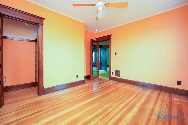 12044 W Duff Washa Rd, Oak Harbor, OH 43449 - unfurnished bedroom with wood finished floors, ornamental molding, and ceiling fan