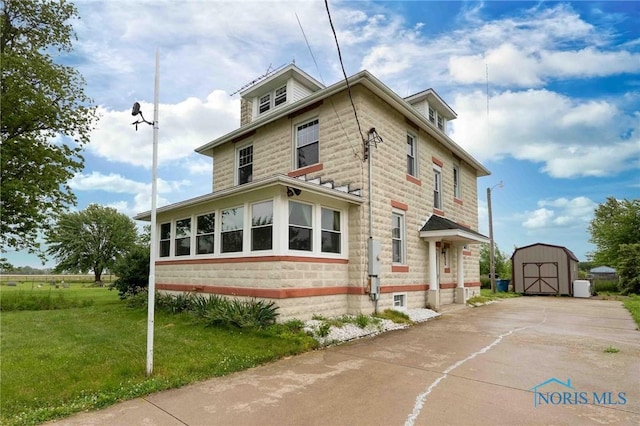 12044 W Duff Washa Rd, Oak Harbor, OH 43449 - american foursquare style home with a shed and a front lawn