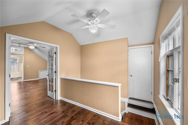 3740 Mapleway Dr, Toledo, OH 43614 - hallway with lofted ceiling, dark wood finished floors, and an upstairs landing