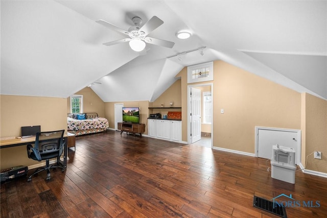 3740 Mapleway Dr, Toledo, OH 43614 - bedroom with vaulted ceiling, hardwood / wood-style flooring, track lighting, and a desk