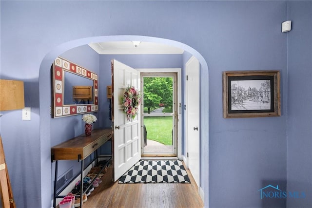 3740 Mapleway Dr, Toledo, OH 43614 - foyer with wood finished floors and arched walkways