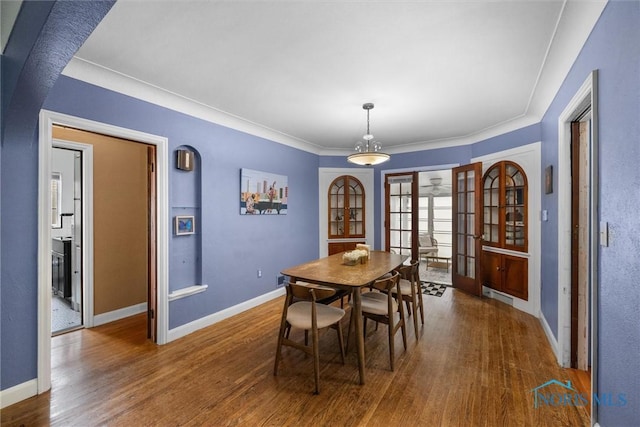 3740 Mapleway Dr, Toledo, OH 43614 - dining area with french doors, wood finished floors, and ornamental molding
