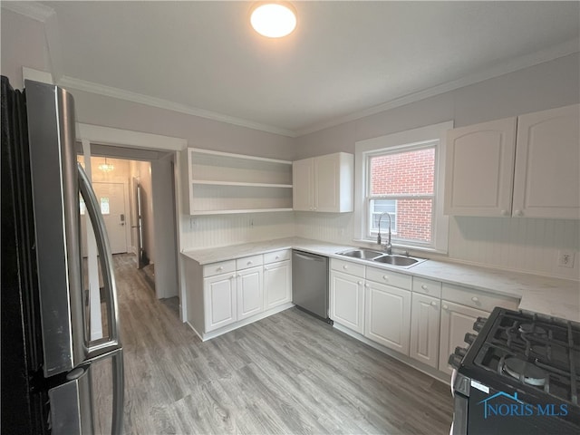 4032 Burnham Ave, Toledo, OH 43612 - kitchen featuring appliances with stainless steel finishes, crown molding, white cabinets, open shelves, and light wood-style floors