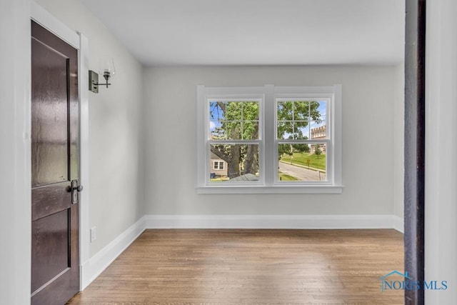 826 4th St, Toledo, OH 43605 - spare room featuring baseboards and wood finished floors