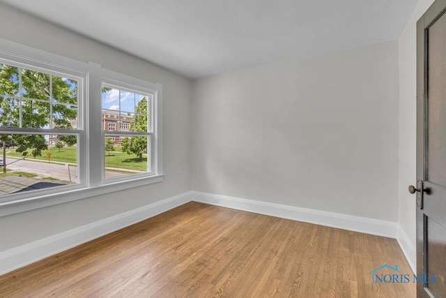826 4th St, Toledo, OH 43605 - unfurnished room featuring baseboards and light wood-type flooring