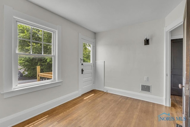 826 4th St, Toledo, OH 43605 - spare room with wood finished floors and baseboards