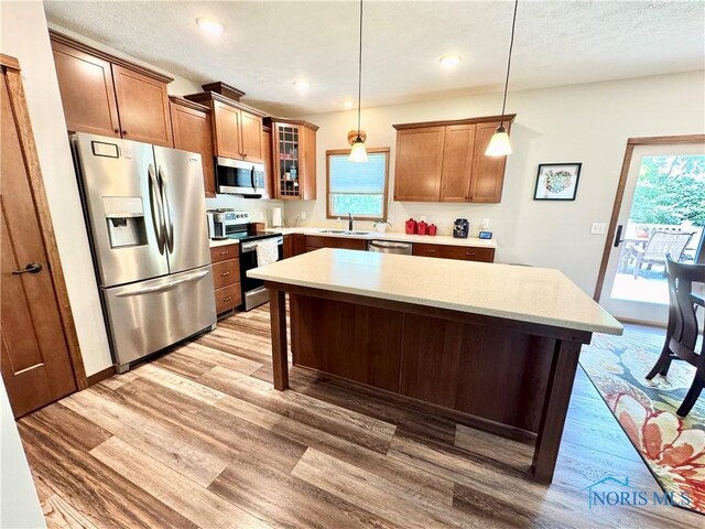 1462 Lee Ann Ave, Defiance, OH 43512 - kitchen with appliances with stainless steel finishes, light wood-style flooring, healthy amount of natural light, a kitchen island, and recessed lighting