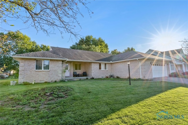 1411 Sawmill Bnd, Findlay, OH 45840 - ranch-style house with a garage, brick siding, a front yard, crawl space, and driveway
