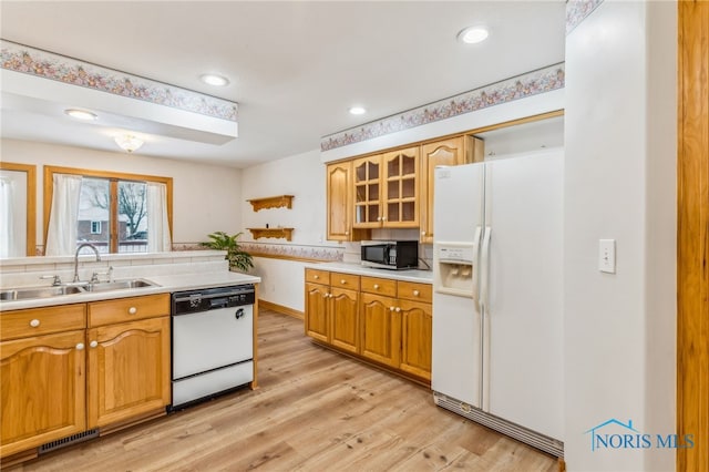 1411 Sawmill Bnd, Findlay, OH 45840 - kitchen featuring white appliances, light wood finished floors, light countertops, glass insert cabinets, and recessed lighting