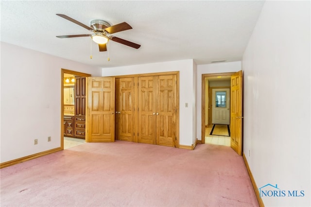 1411 Sawmill Bnd, Findlay, OH 45840 - unfurnished bedroom featuring light colored carpet, ensuite bathroom, ceiling fan, and a closet