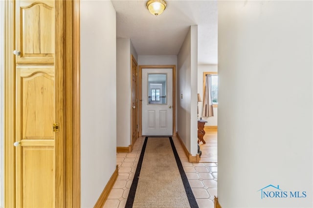 1411 Sawmill Bnd, Findlay, OH 45840 - corridor with baseboards and light tile patterned flooring