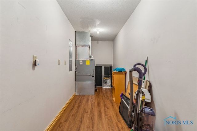 1411 Sawmill Bnd, Findlay, OH 45840 - hallway with wood finished floors, electric panel, and a textured ceiling