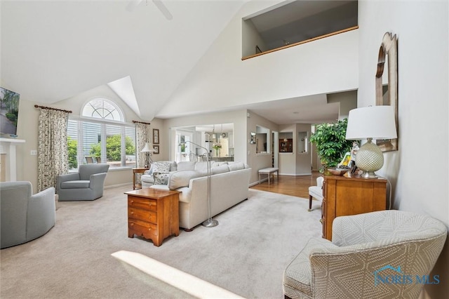 7445 Country Commons Ln Unit 7445, Sylvania, OH 43560 - carpeted living room featuring high vaulted ceiling and a ceiling fan