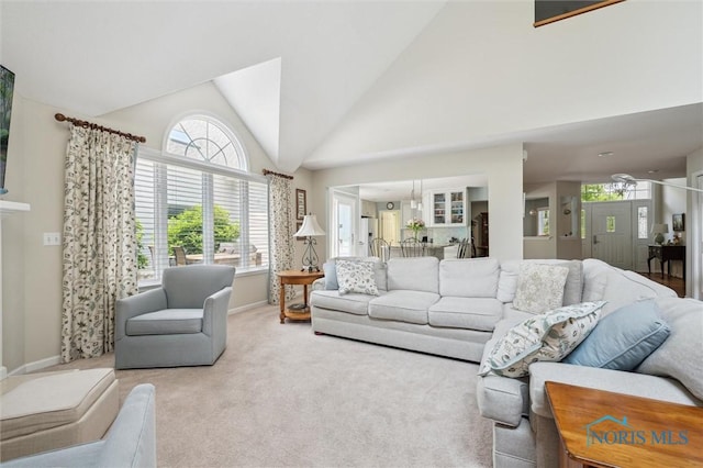7445 Country Commons Ln Unit 7445, Sylvania, OH 43560 - carpeted living room featuring plenty of natural light and vaulted ceiling