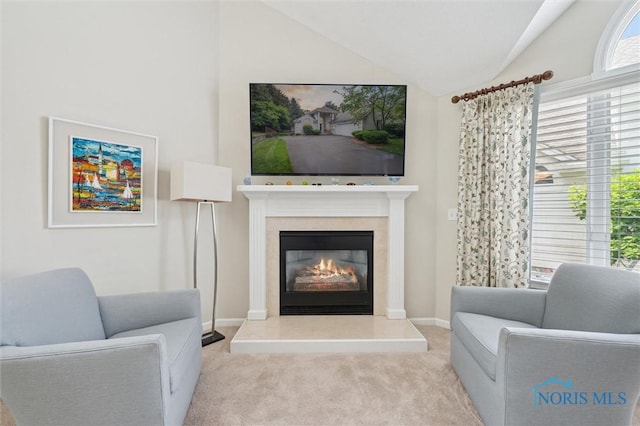 7445 Country Commons Ln Unit 7445, Sylvania, OH 43560 - living area featuring lofted ceiling, carpet flooring, and a glass covered fireplace