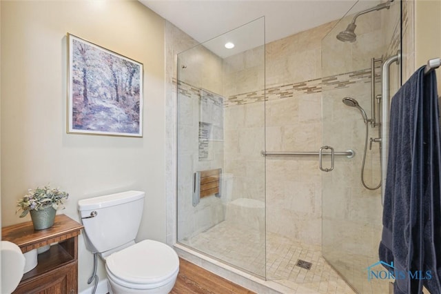 7445 Country Commons Ln Unit 7445, Sylvania, OH 43560 - bathroom featuring a shower stall, wood finished floors, vanity, and recessed lighting