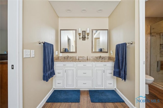 7445 Country Commons Ln Unit 7445, Sylvania, OH 43560 - bathroom featuring wood finished floors, a shower stall, double vanity, and a chandelier
