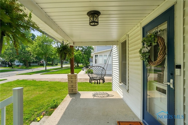 638 W Elm St, Wauseon, OH 43567 - porch featuring a lawn