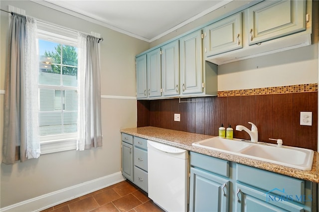 638 W Elm St, Wauseon, OH 43567 - kitchen with dishwasher, light countertops, crown molding, blue cabinets, and dark tile patterned floors