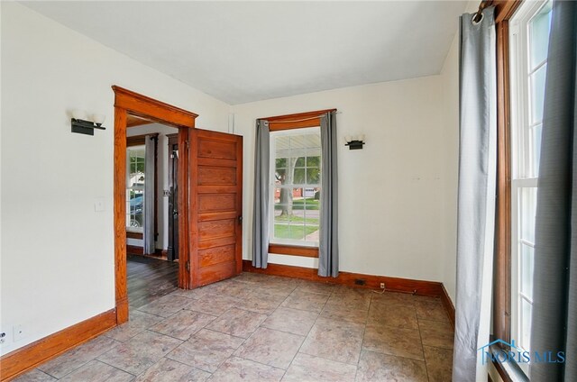 638 W Elm St, Wauseon, OH 43567 - unfurnished room featuring baseboards and light stone finish floors