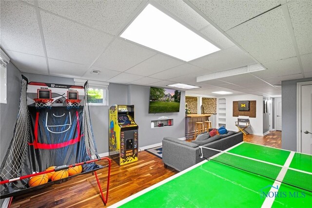 7910 Quail Creek Rd, Maumee, OH 43537 - playroom featuring wood finished floors, a paneled ceiling, and built in features