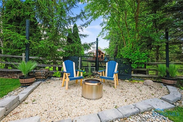 7910 Quail Creek Rd, Maumee, OH 43537 - view of patio with an outdoor fire pit
