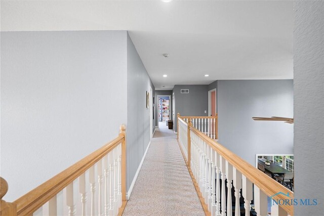 7910 Quail Creek Rd, Maumee, OH 43537 - hallway with an upstairs landing, recessed lighting, and carpet