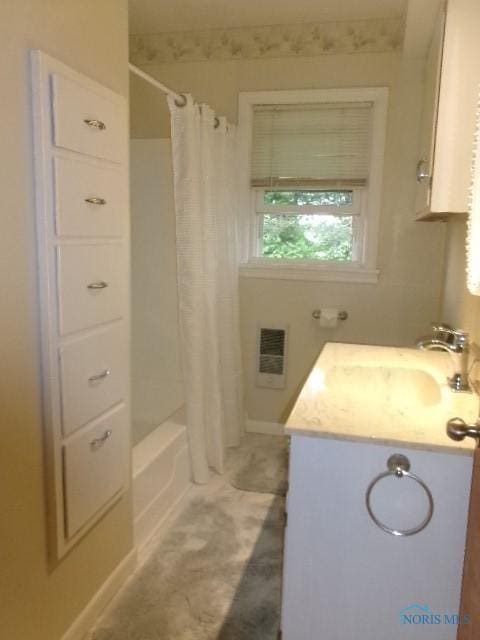 8962 State Route 109, Ottawa, OH 45875 - bathroom featuring vanity, shower / bath combo with shower curtain, and heating unit