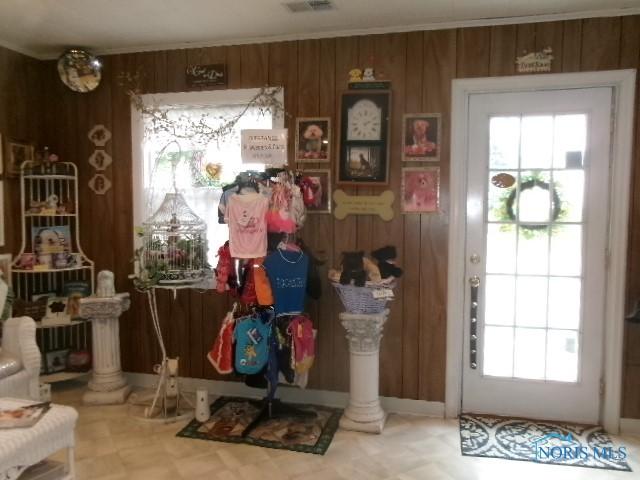 8962 State Route 109, Ottawa, OH 45875 - foyer with healthy amount of natural light, wooden walls, and tile patterned floors