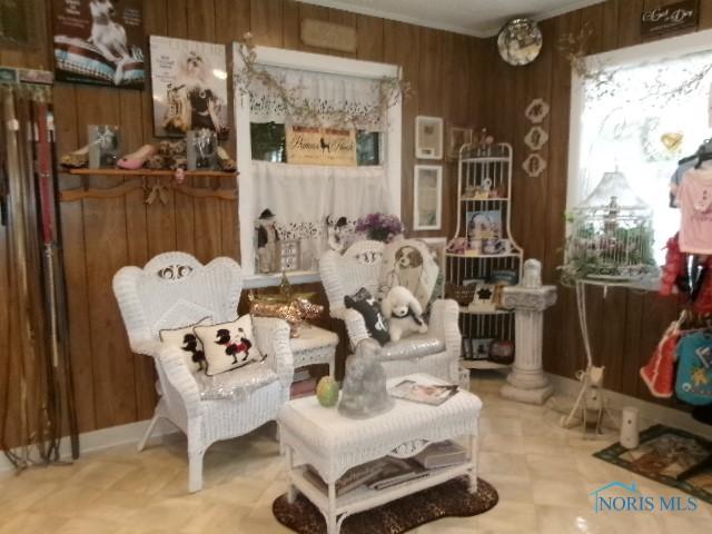 8962 State Route 109, Ottawa, OH 45875 - living area with wood walls and tile patterned floors