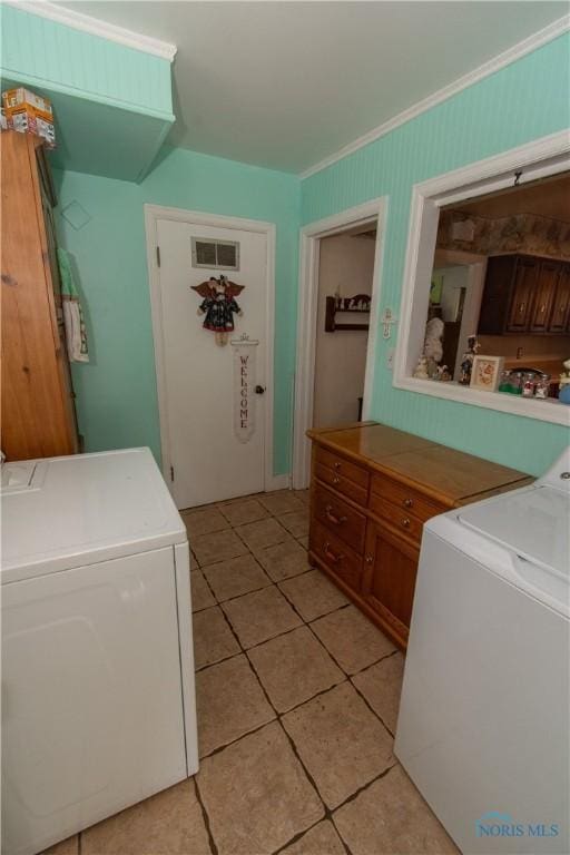 2823 Wicklow Rd, Toledo, OH 43606 - laundry area with ornamental molding, light tile patterned floors, and washer and dryer