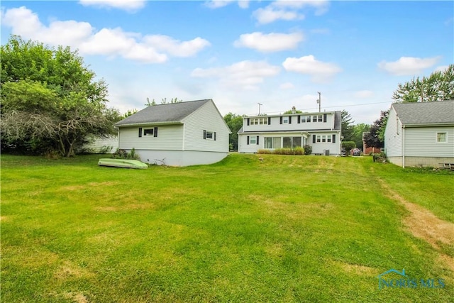 1013 Whittlesey St, Fremont, OH 43420 - rear view of property featuring a yard