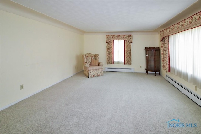 1013 Whittlesey St, Fremont, OH 43420 - unfurnished room with a baseboard heating unit and carpet floors