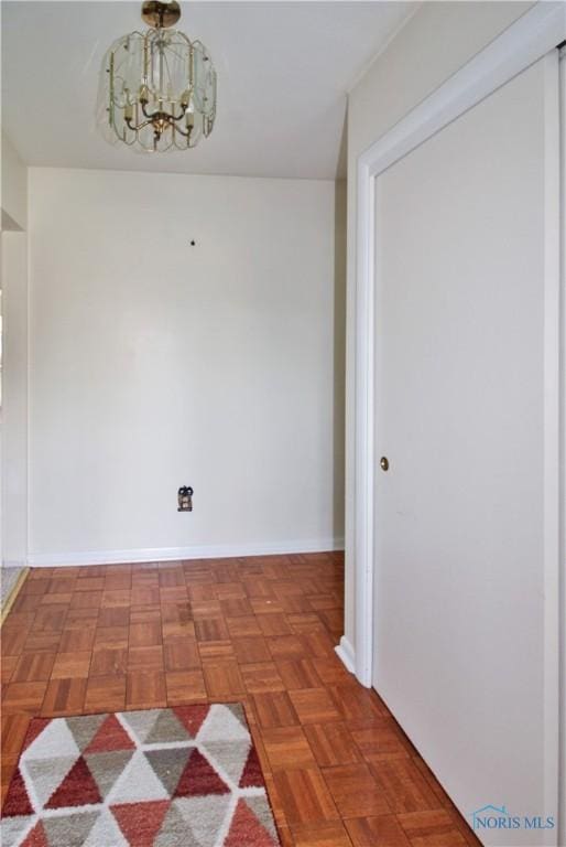 1013 Whittlesey St, Fremont, OH 43420 - unfurnished room featuring a chandelier and baseboards