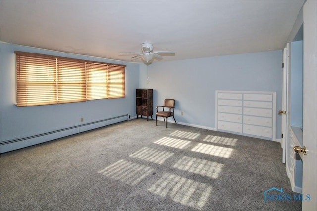 1013 Whittlesey St, Fremont, OH 43420 - carpeted spare room featuring a baseboard heating unit and ceiling fan