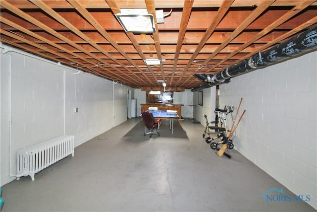 1013 Whittlesey St, Fremont, OH 43420 - basement featuring radiator and concrete block wall