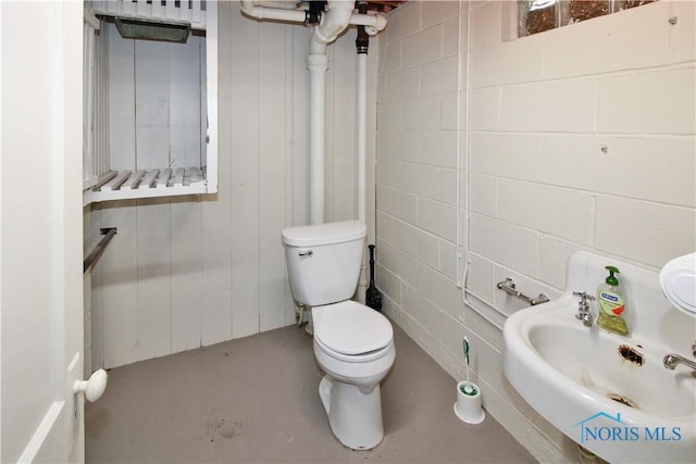 1013 Whittlesey St, Fremont, OH 43420 - half bathroom featuring toilet and finished concrete flooring