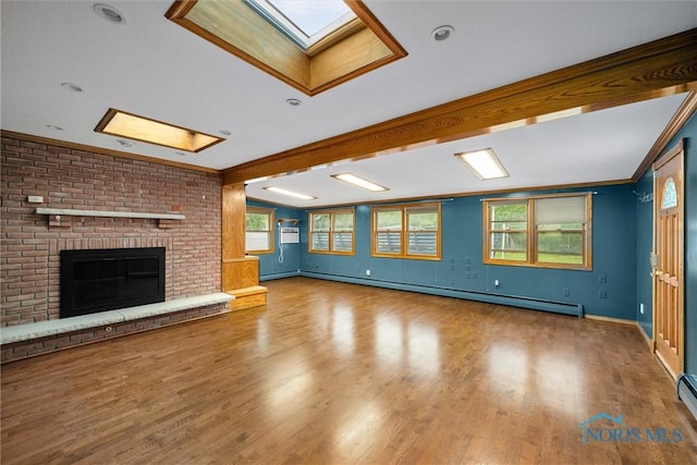 6005 Bahiamar Rd, Toledo, OH 43611 - unfurnished living room with a skylight, baseboard heating, wood finished floors, and a fireplace