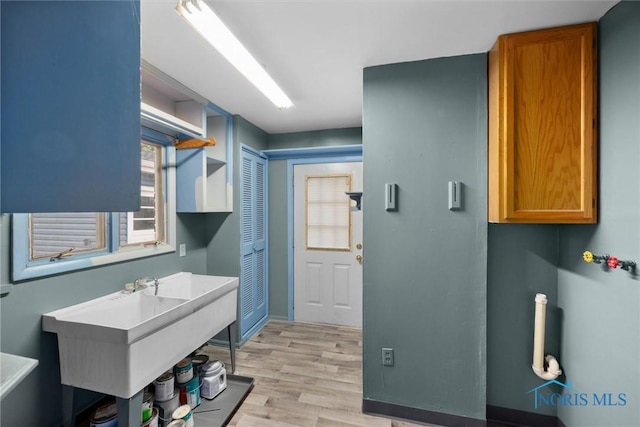 6005 Bahiamar Rd, Toledo, OH 43611 - bathroom featuring wood finished floors and a sink
